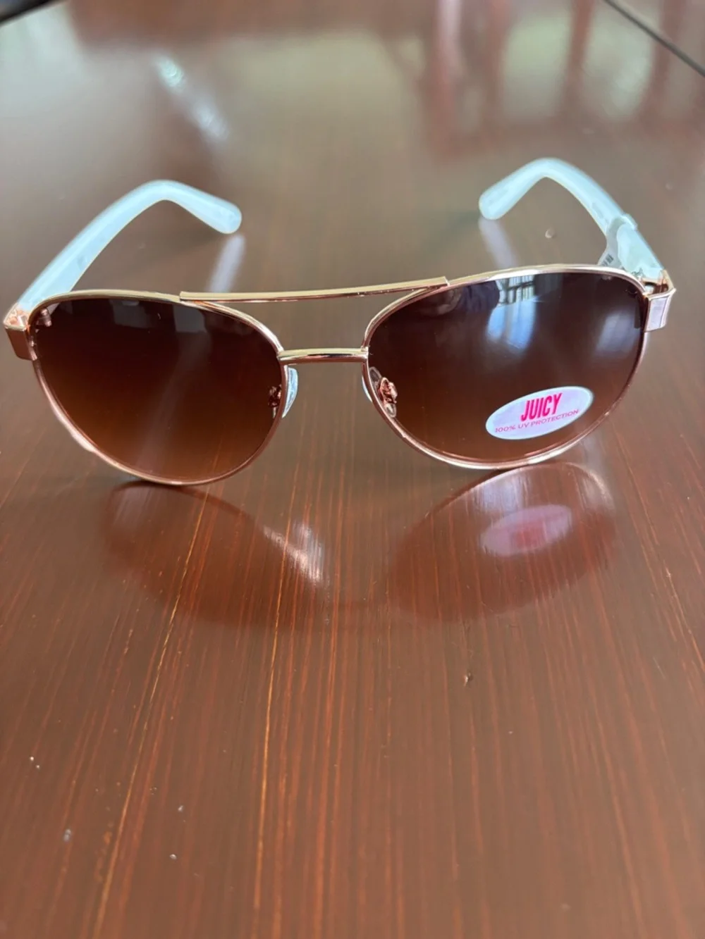 Juicy Coutture 100% UVA-UVB protect,brown gradient lens,gold frame,white arms